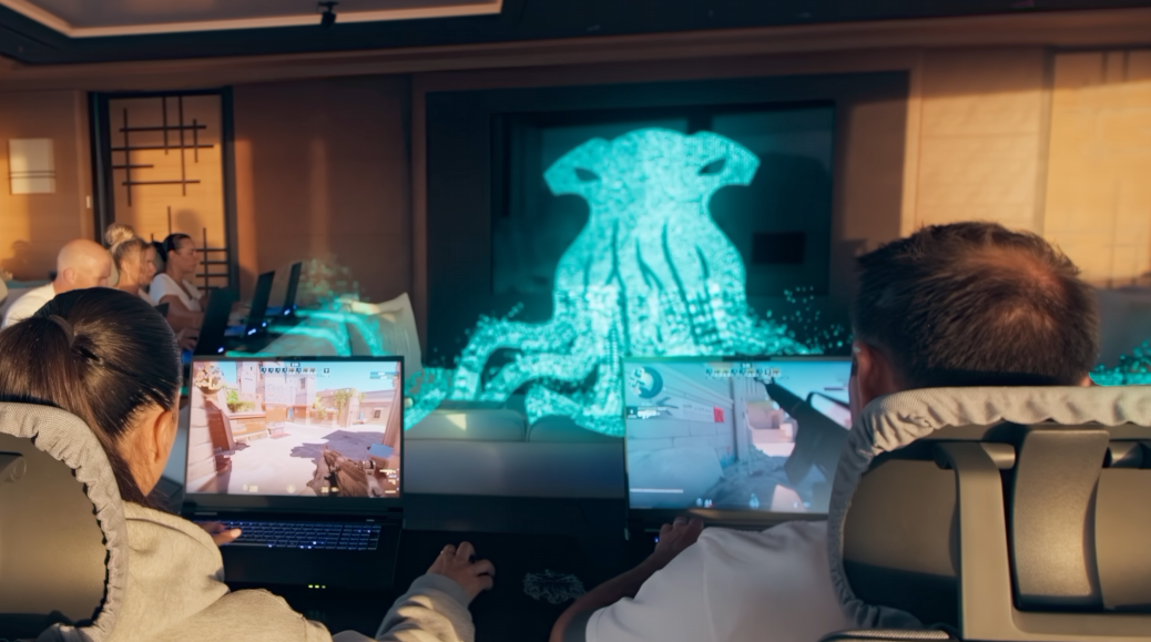 A CGI squid in the centre of a conference room connects its tentacles into computers people are playing Counter-Strike on.