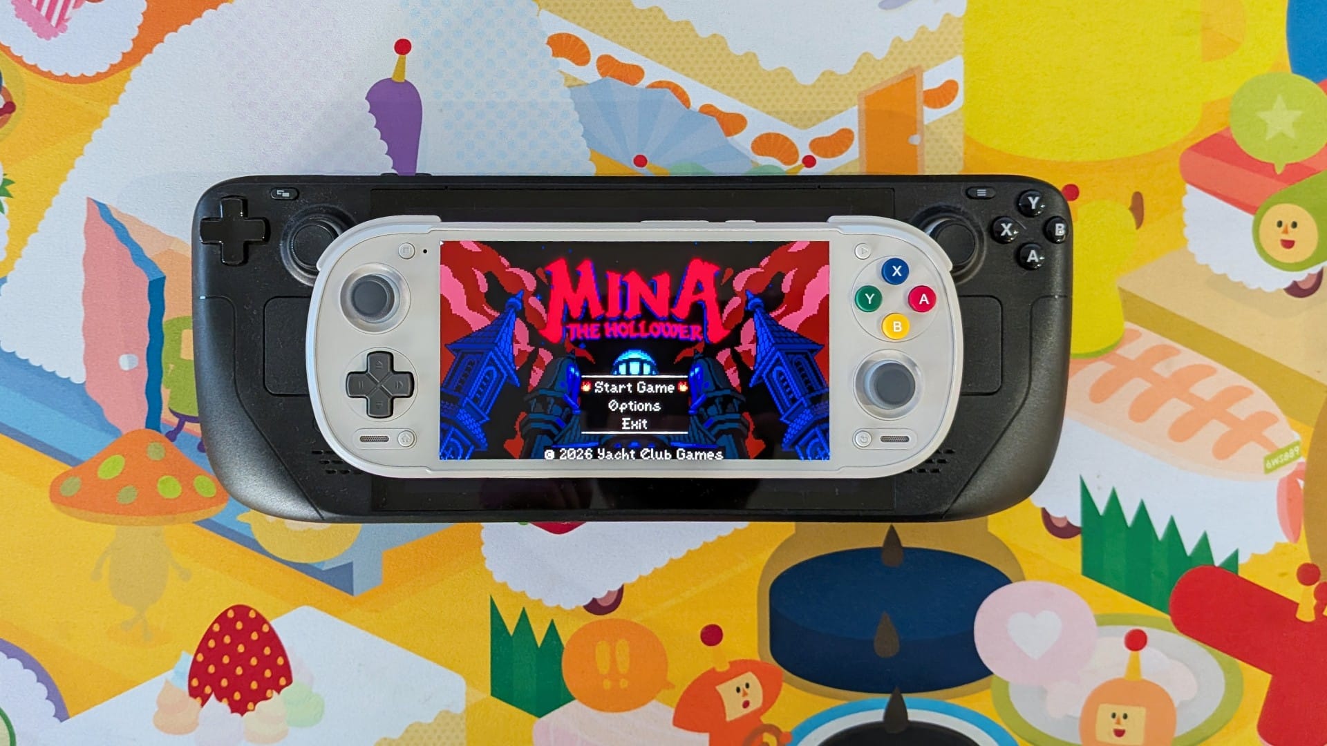 The Retroid Pocket 6 placed on top of the Steam Deck.