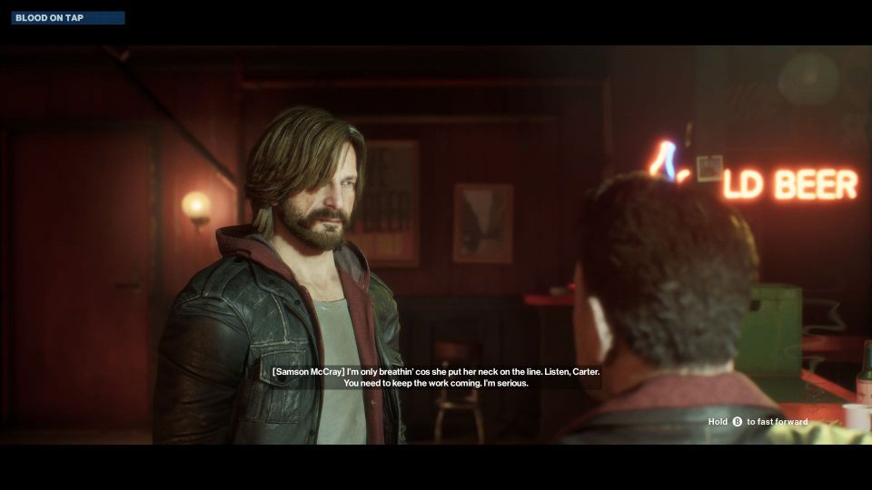 A shot of a cutscene showing the player character talking to somebody in a bar.