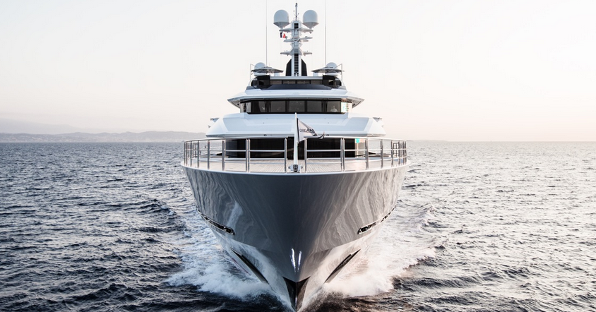 A superyacht, heading directly towards the camera.
