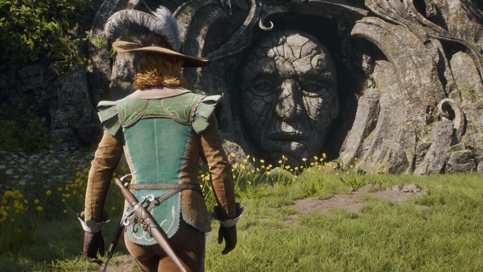  A screenshot of the new Fable, showing the hero approaching a giant stone head set in the mouth of a cave.