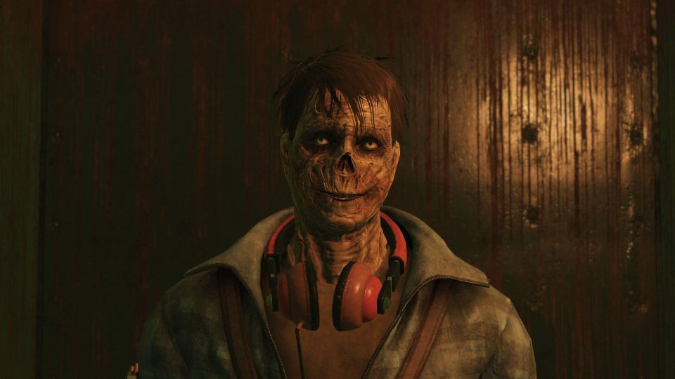 A Fallout 76 screenshot showing a ghoul with some wired can headphones around its neck