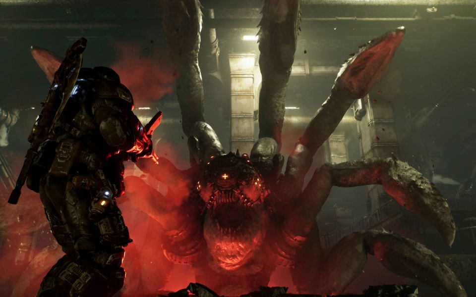 A monstrous spider-creature rears up out of the ground, as fat-legged protagonist Marcus Fenix brings his gun to bear.