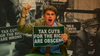 An angry protester holds a sign that states, "tax cuts for the rich are obscene."