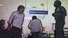 Travelers walk past a “Security Checkpoint” sign in an airport, as a security guard looks on.