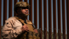 A Marine stands in front of a border wall on March 21, 2025, in San Diego, California.