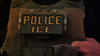 An image of an ICE officer’s uniform showing the words “POLICE ICE.”