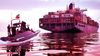 An Iranian Revolutionary Guard Navy speedboat approaches a cargo ship in the Strait of Hormuz.