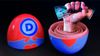 A surreal composite image of a wooden nesting doll with the Democratic Party logo on its surface. A fist holding $100 bills is emerging from the center of the doll.