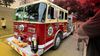 A firetruck in a parking lot.