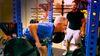 U.S. Senate candidate Abdul El-Sayed watches journalist David Sirota lifting weights in a gym.