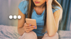 Image of a woman on her phone with three dots overlaid.