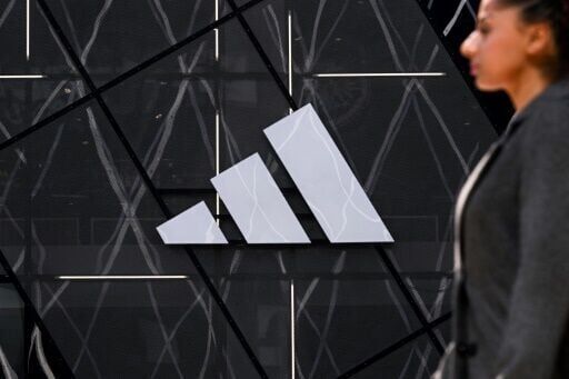 Adidas shares slump on downbeat profit outlook