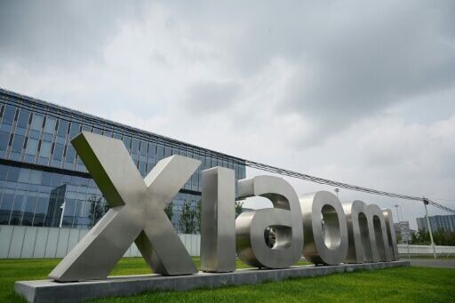 Xiaomi quarterly profit slumps despite annual EV gains