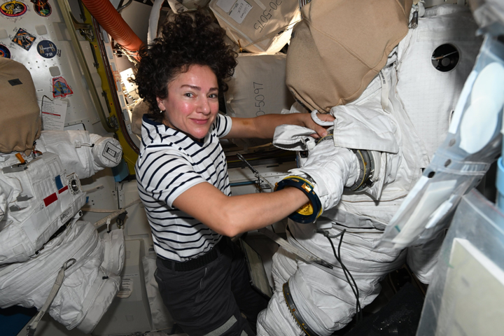Astronaut preps spacesuit for upcoming spacewalk