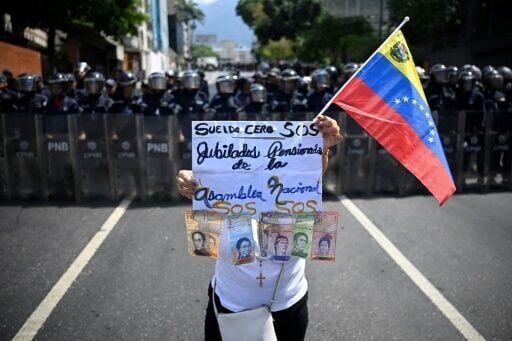 Venezuelan protesters call government wage hike a joke