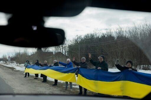 'We will wait for each one': Ukrainians greet POWs with tears and cheers