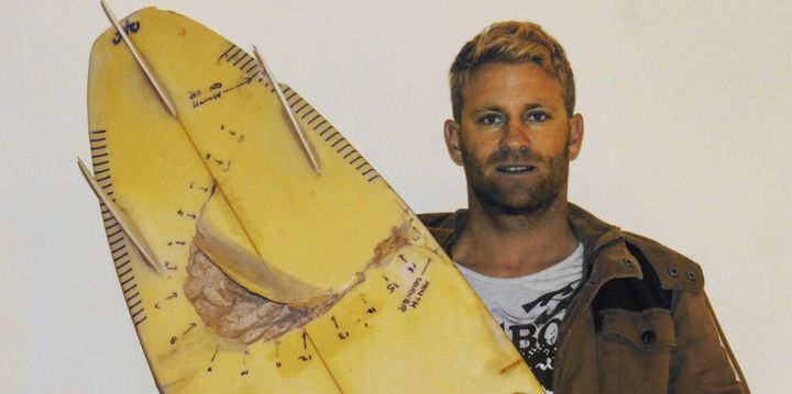 Surfer attacked by two sharks paddled to safety with one hand