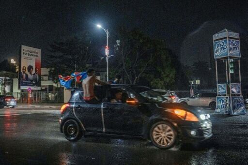 DR Congo fans dance in the rain after sealing World Cup spot