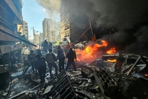 In the heart of Beirut, buildings in flames and charred cars