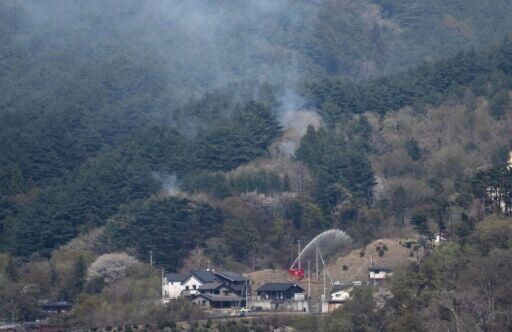 Hundreds of firefighters battle Japan forest blazes