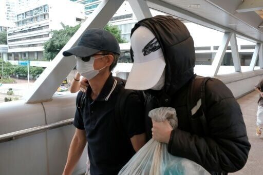 Hong Kong sentences father of wanted activist to 8 months in jail