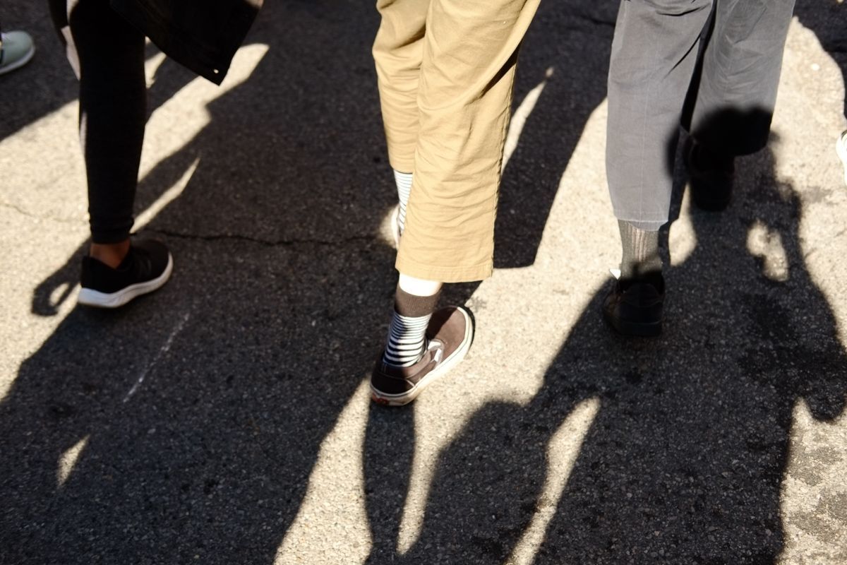 Feet marching, shadow of your photographer.