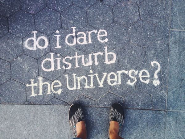 POV with shoes, Toms, chalked in hex stone tile, 'do i dare disturb the Universe?'