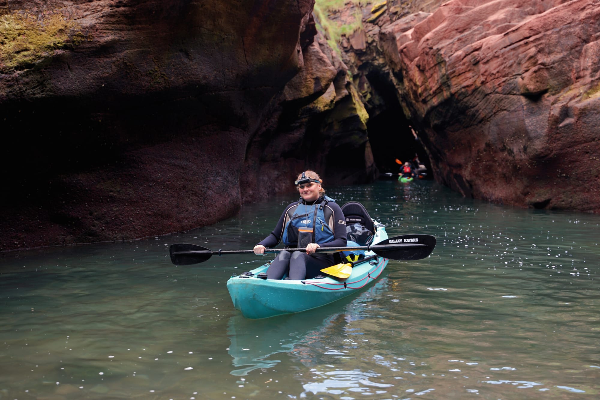 Jacki in a blue two-seater kayak.