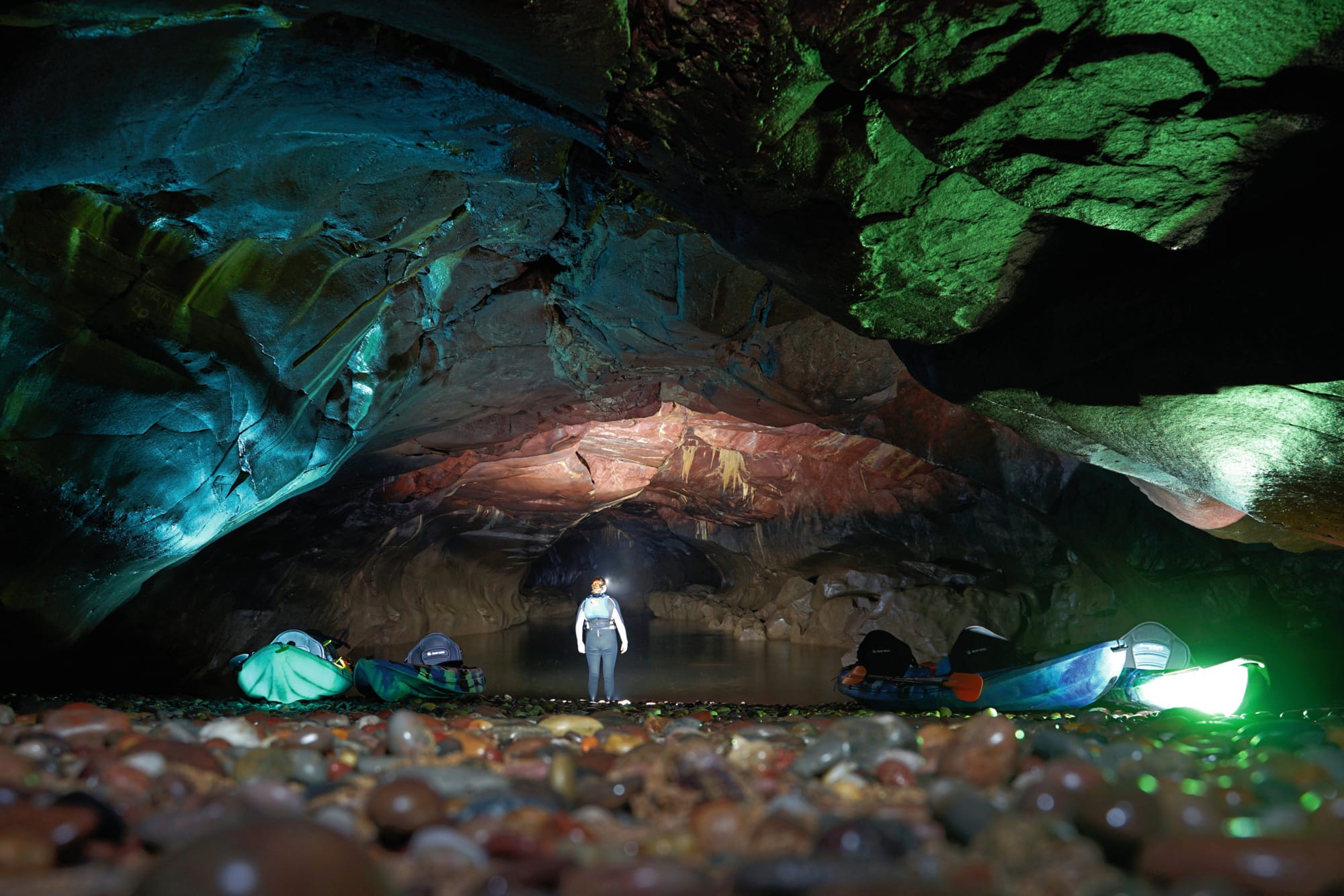 The stony beach and underground Bunker Cave.