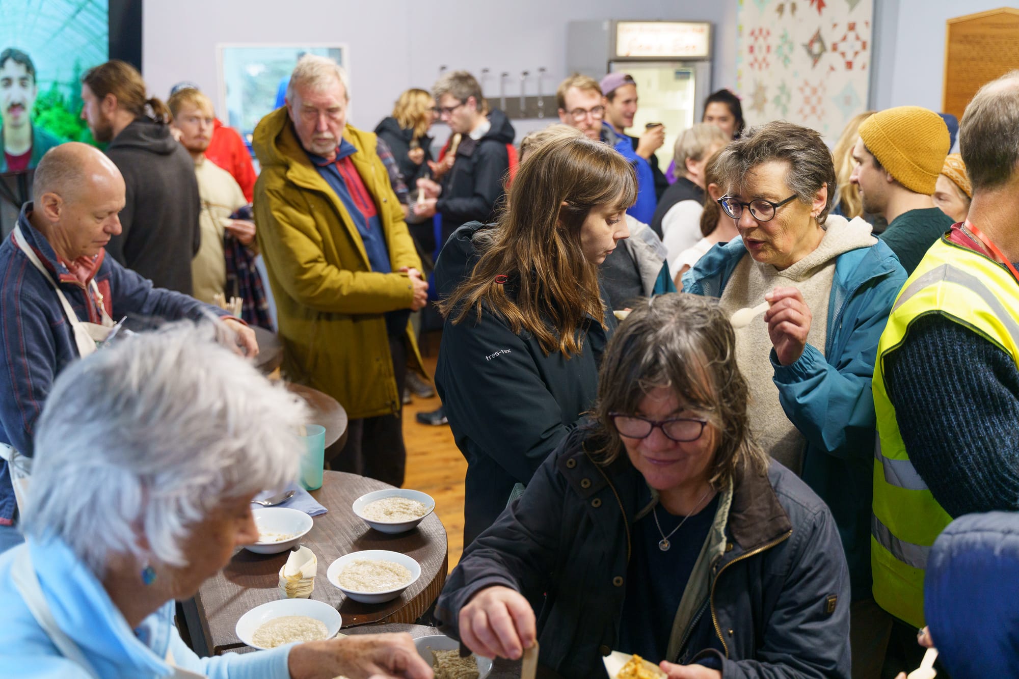 Spectators taste the porridge.