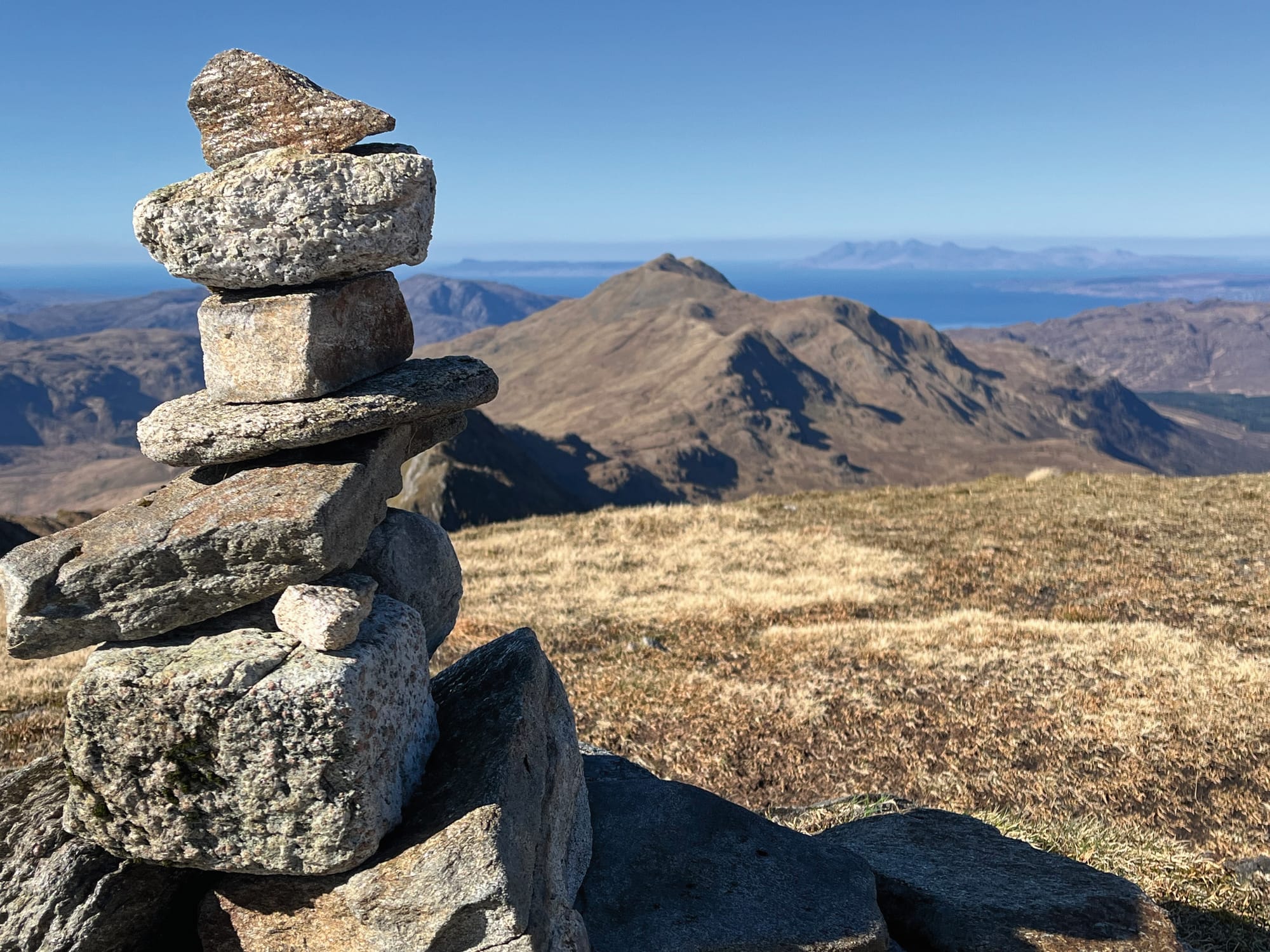 A small cairn of stones marking the top of the mountain.
