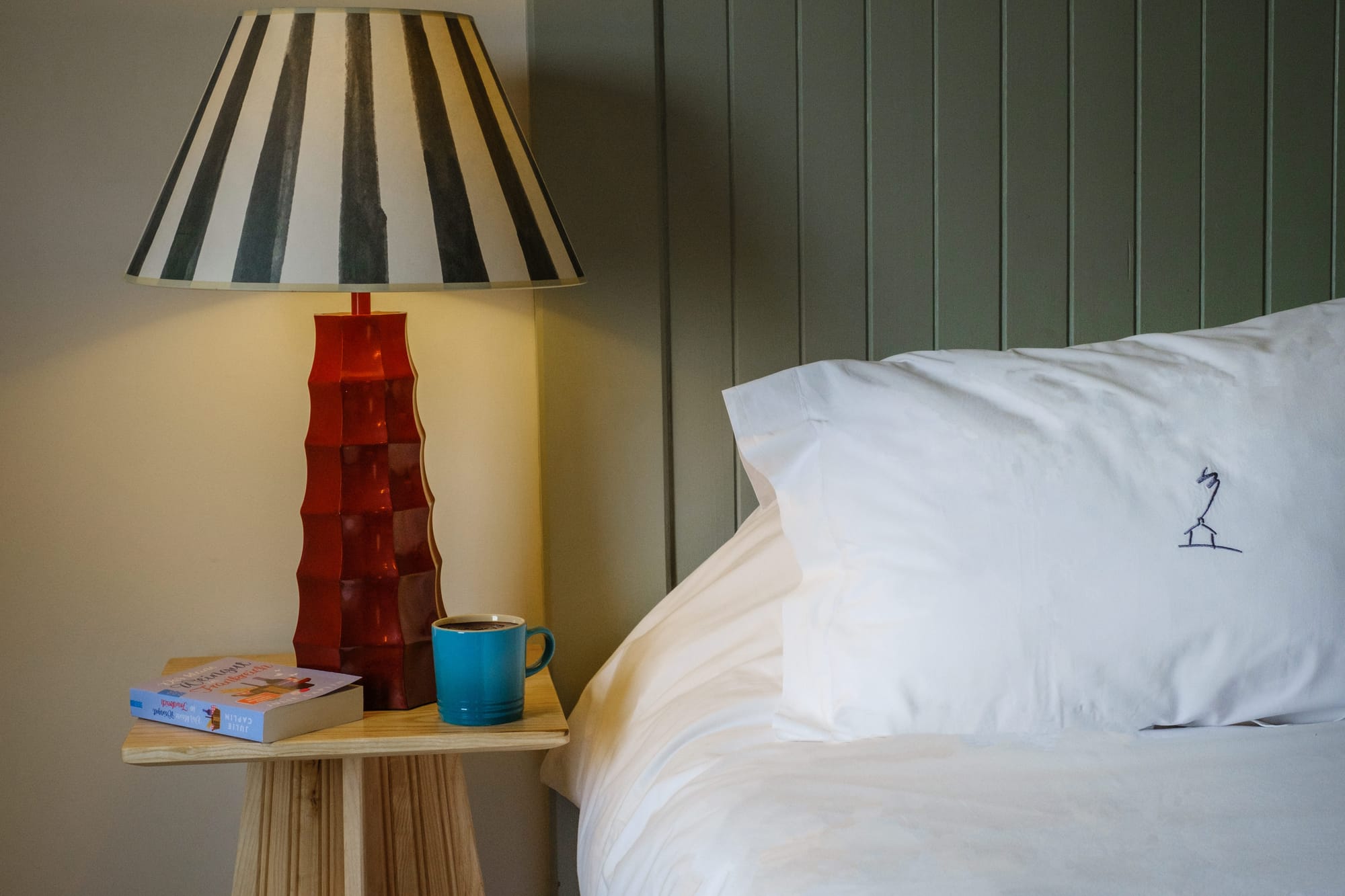 Interiors from the Three Chimneys rooms, showing the bed and beside table