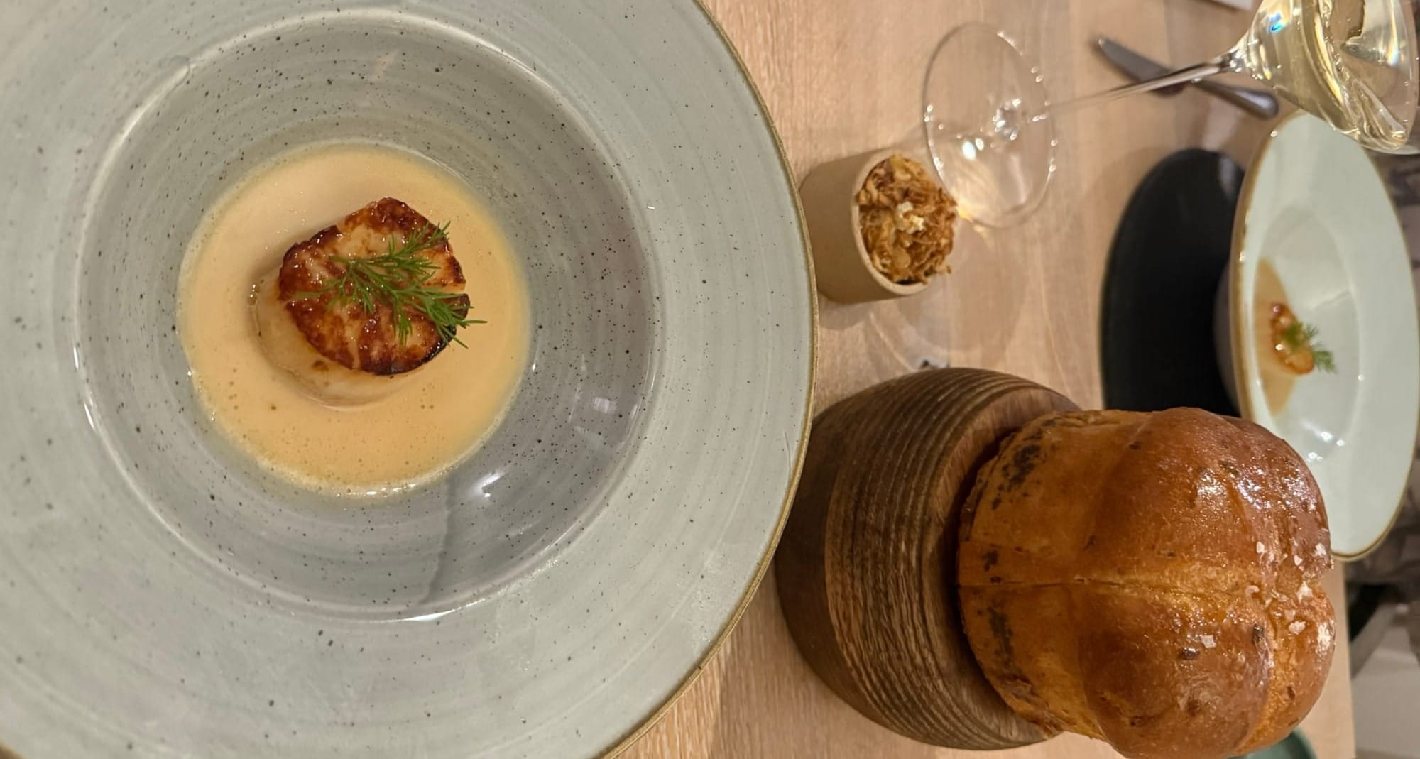The third course of the evening - a perfectly-seared Sconser scallop, served with brioche