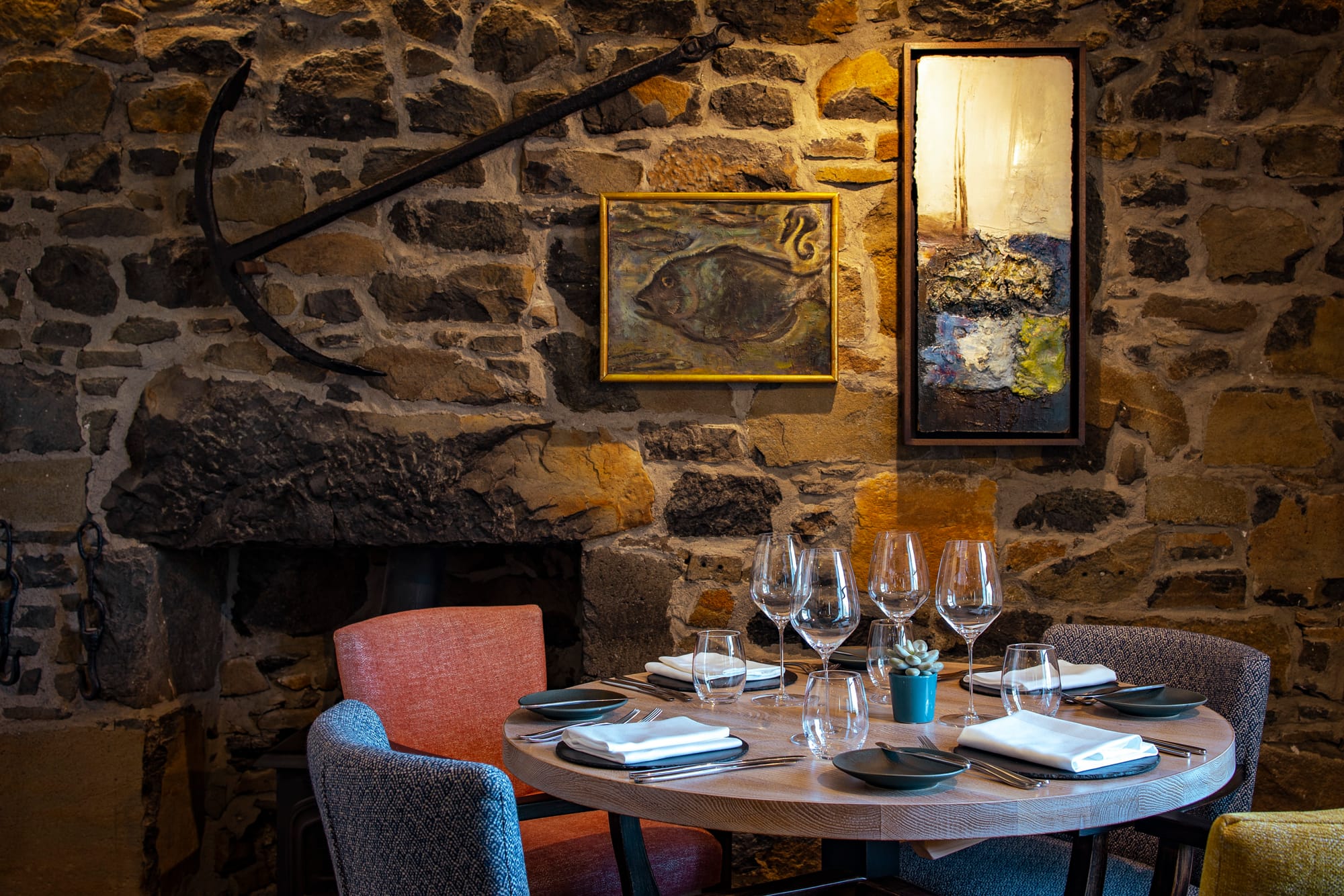 The Three Chimneys dining room is rustic and has exposed brick walls
