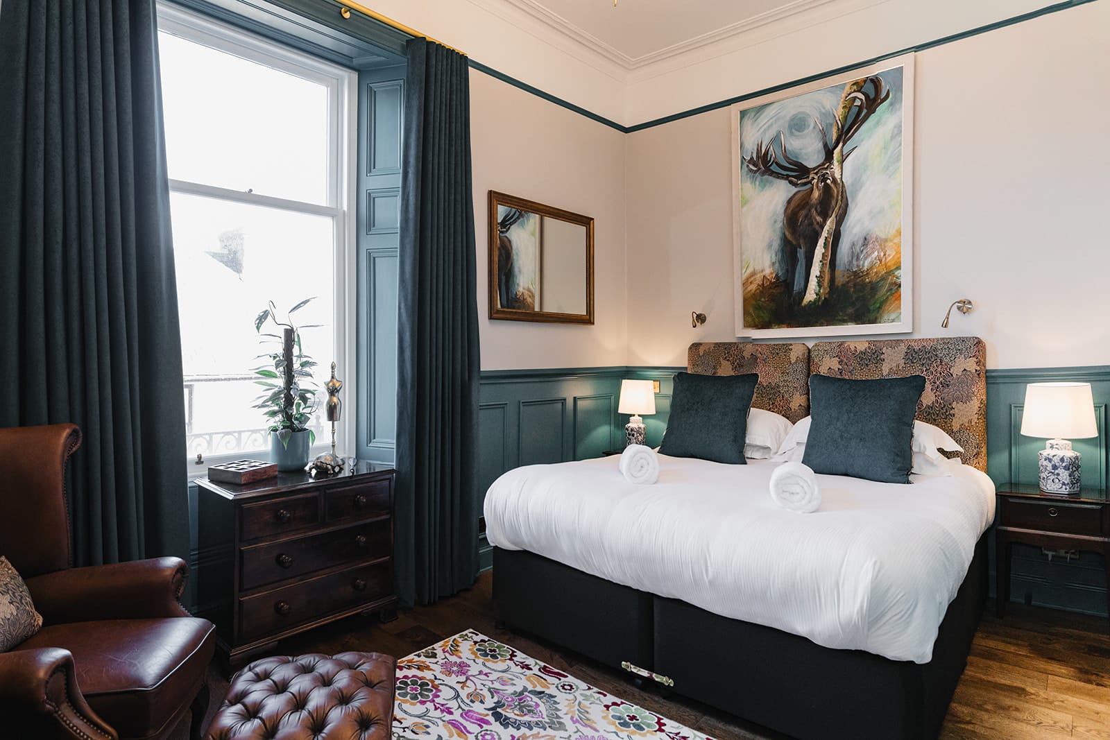 A bedroom with blue furnishings. 