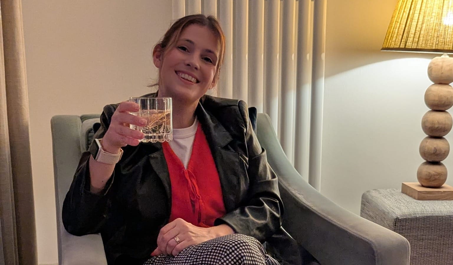 Daniella enjoying a nightcap before bed in the sitting room