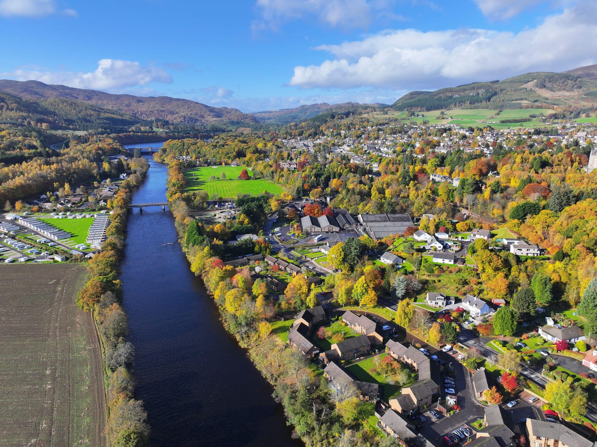 An aerial view of Pitlochry with the River Tummel running through the centre.