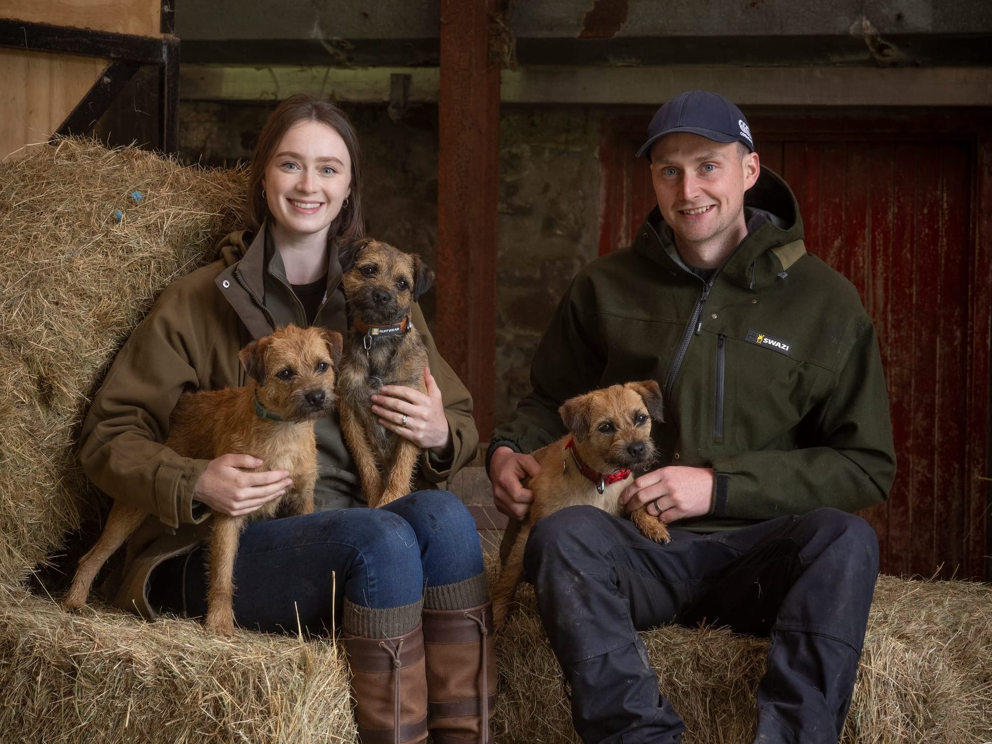 Ceitidh and Cameron Galbraith, two people Peter spoke with for the book, with their three Border Terriers.