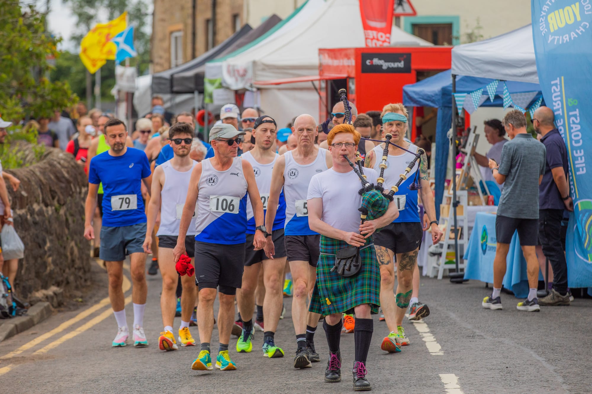 A parade walking through Ceres streets during the Highland Games.