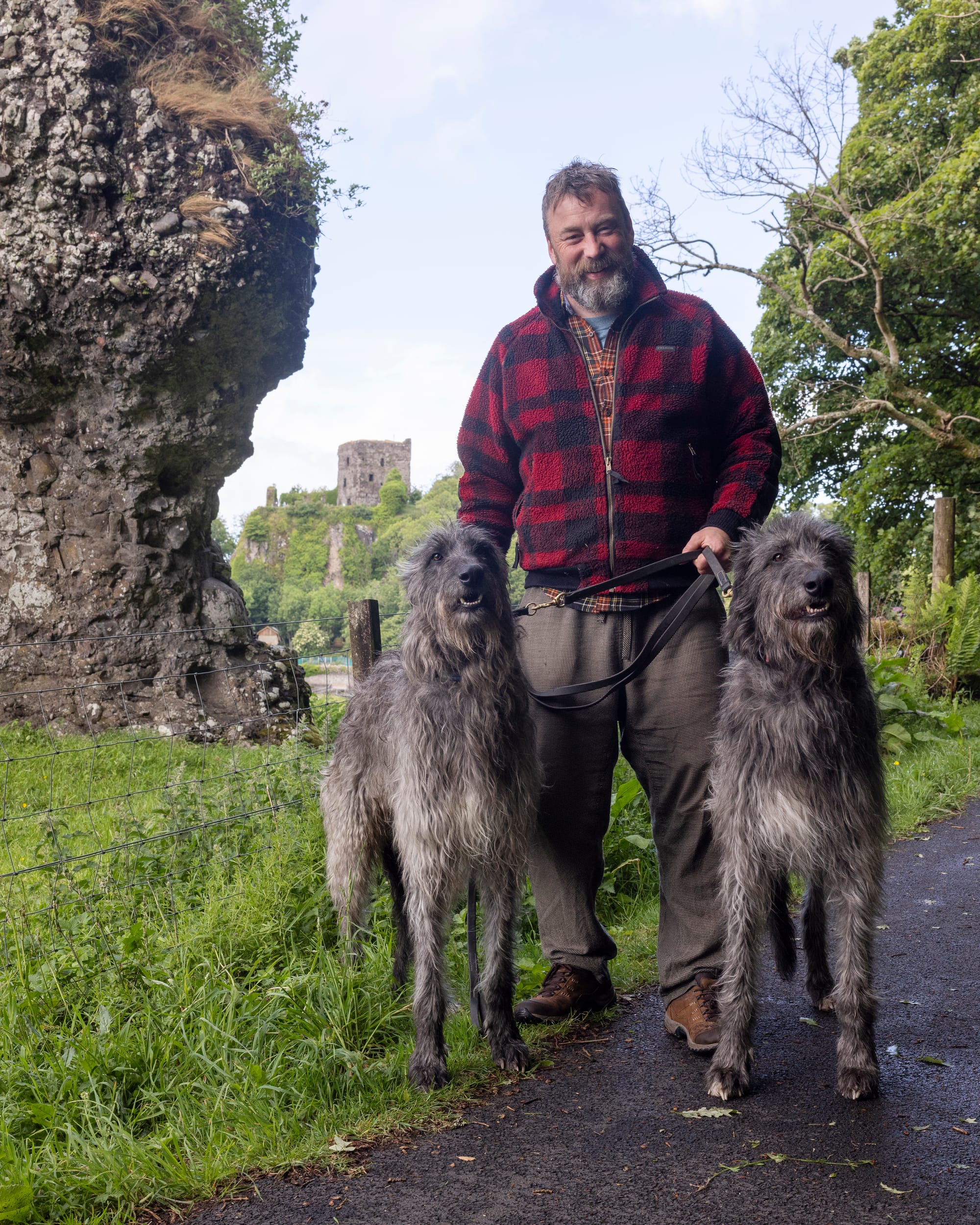 Peter MacQueen and two Scottish Deerhounds.