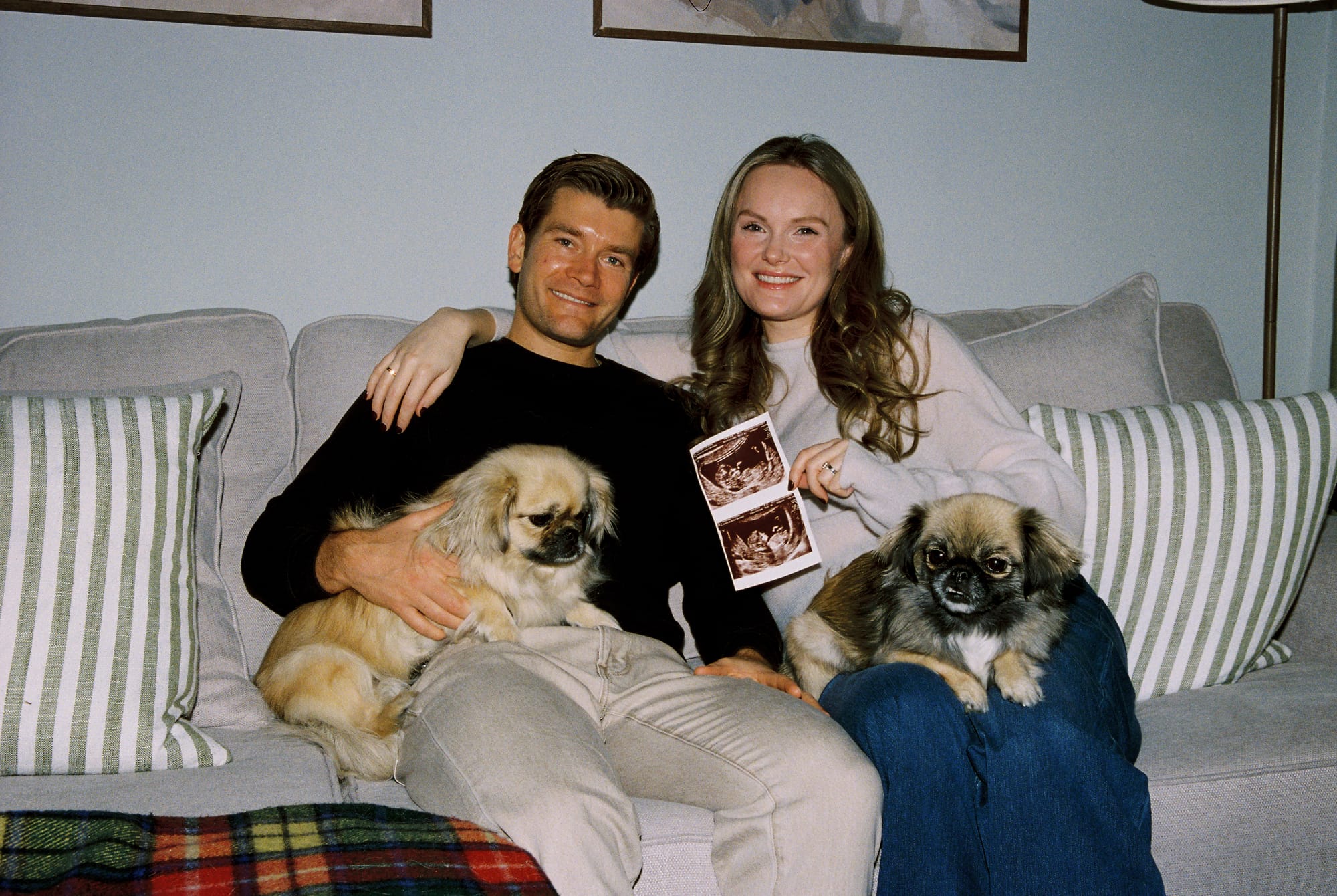 Iona at home with her husband and two dogs.