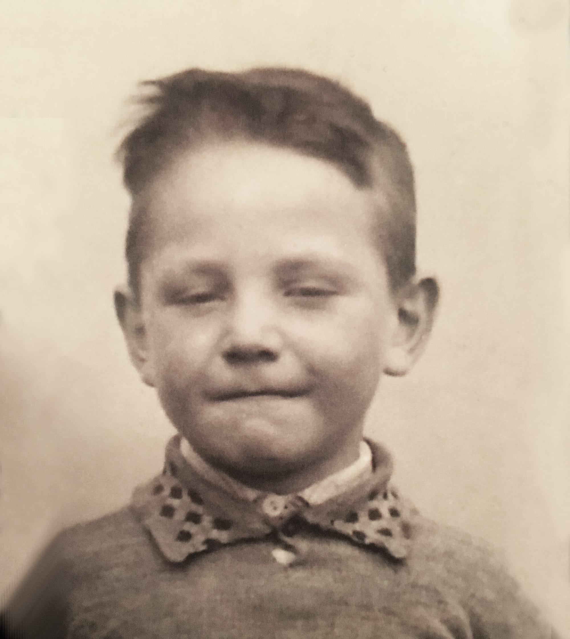 A 3 year old boy in a black and white photo.