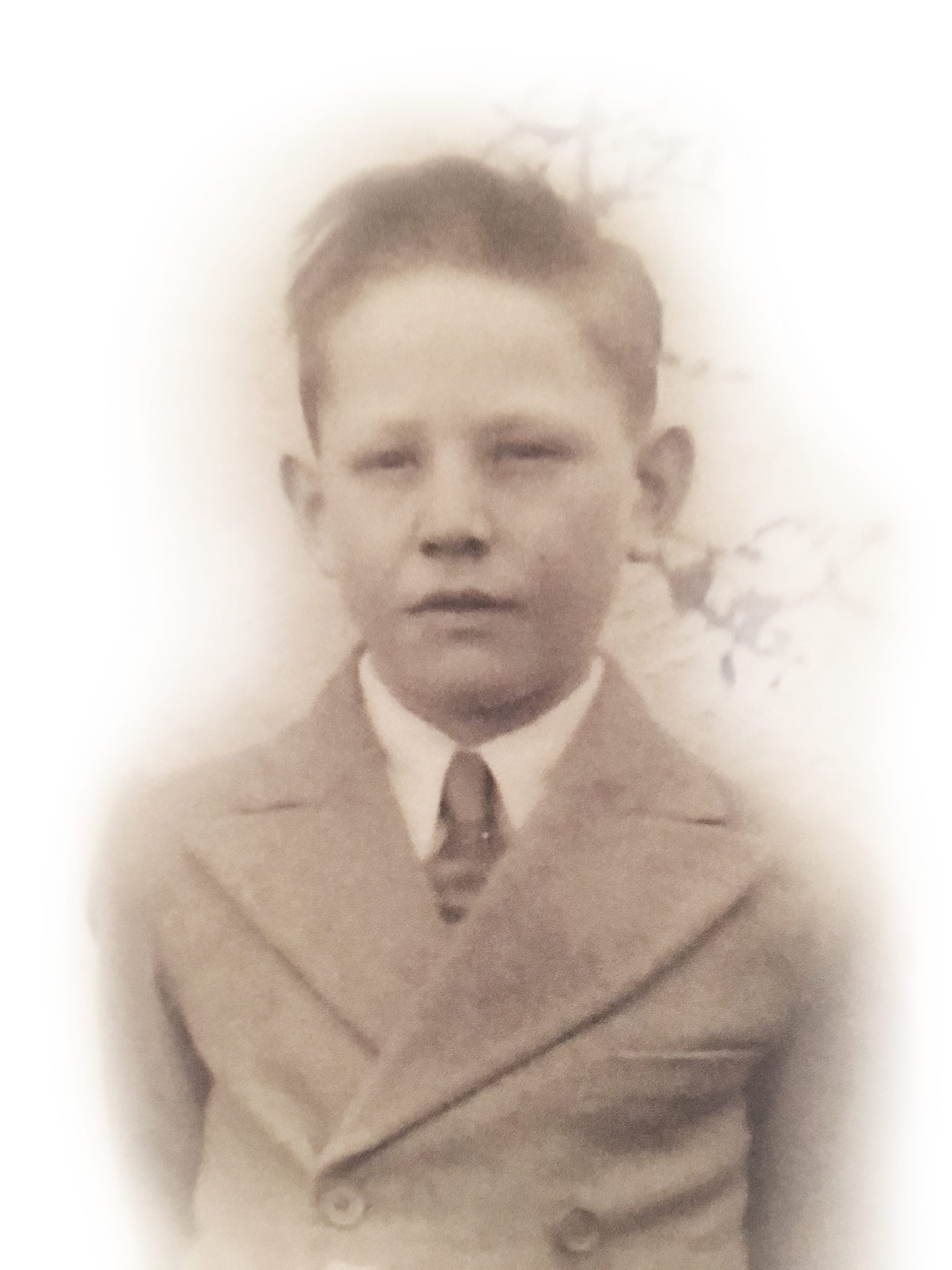 Boy aged 10 in black and white photo.