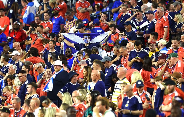 Scotland fans in the crowd of a football match.