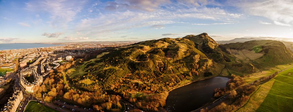 An aerial view of Arthur's Seat looking across Edinburgh and to the Forth.