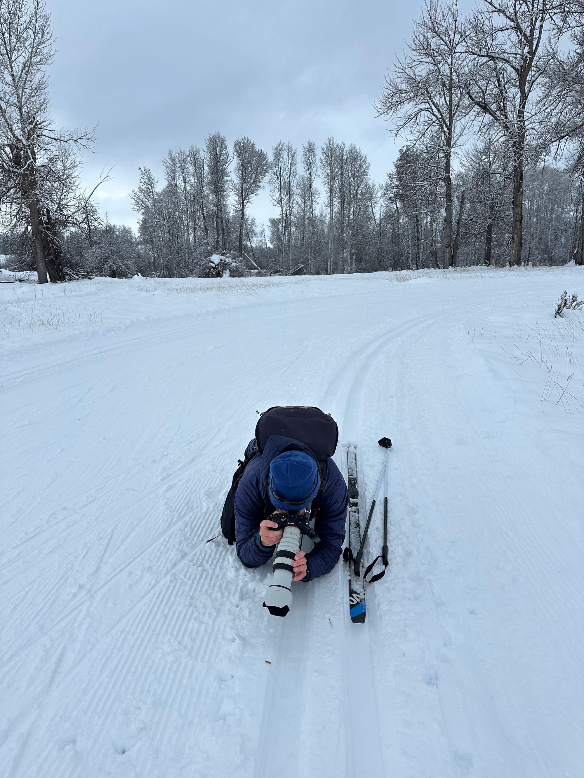 David Lukas laying on snow