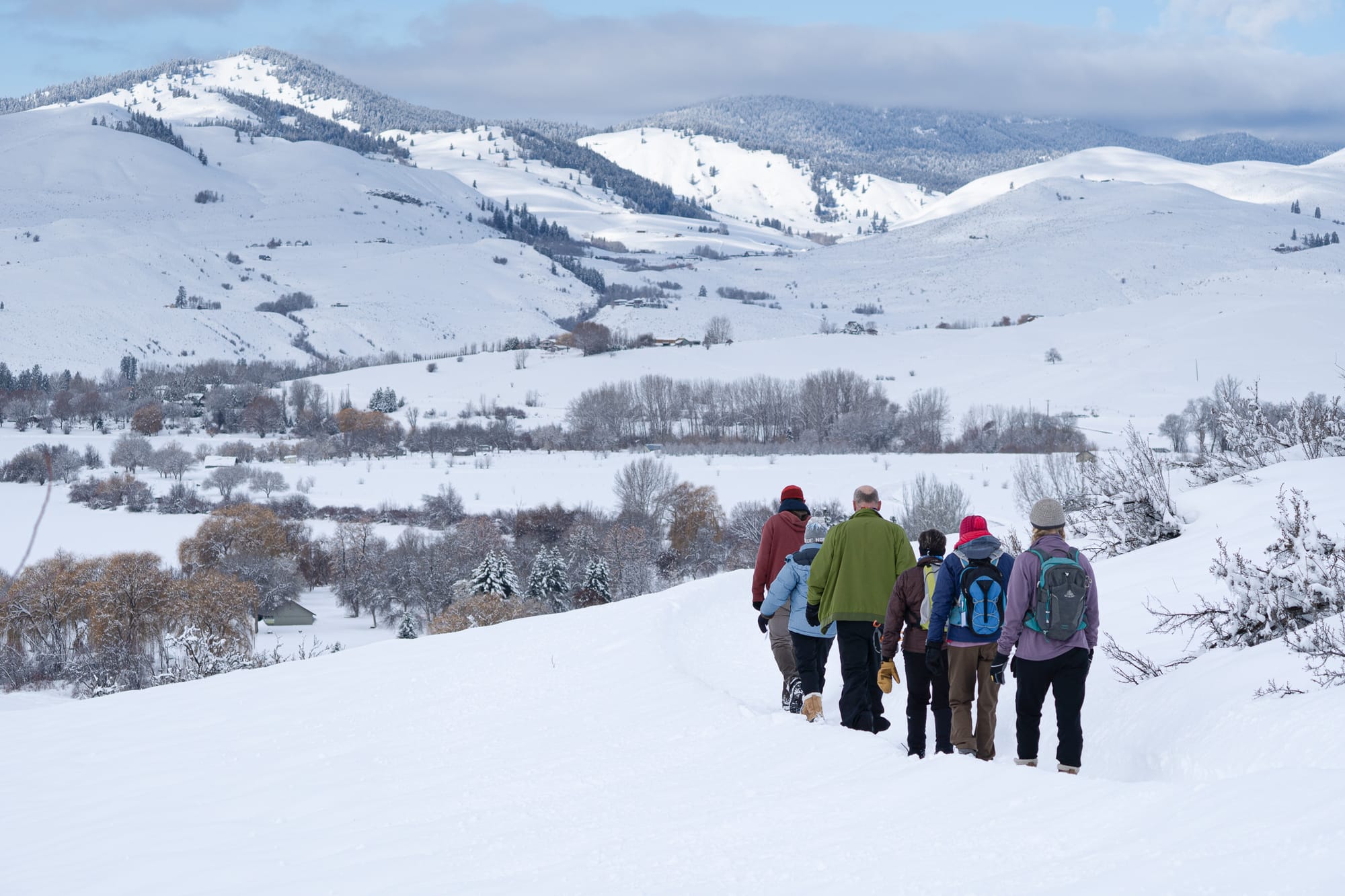 people hiking in snow