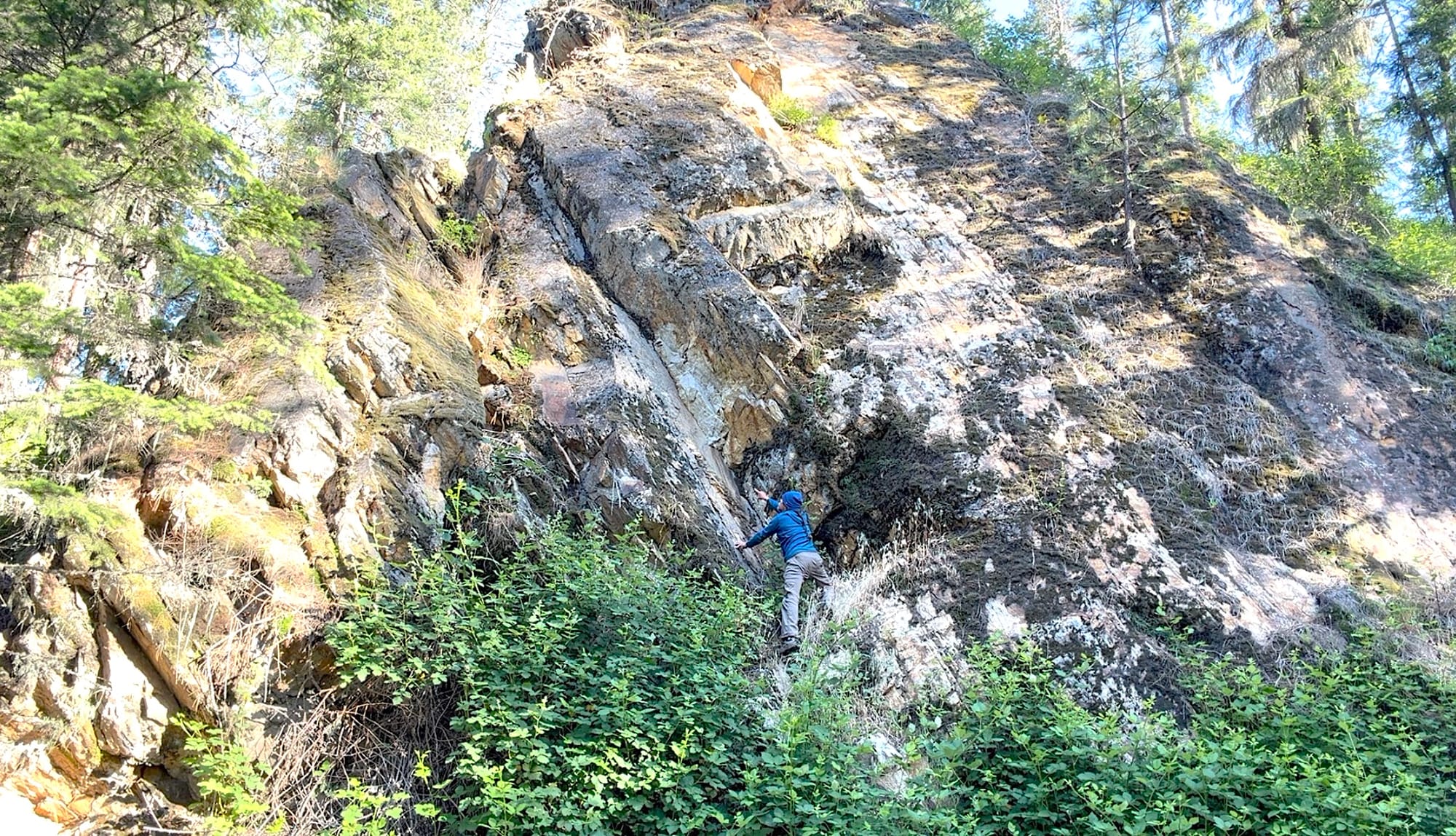 standing on a rock formation