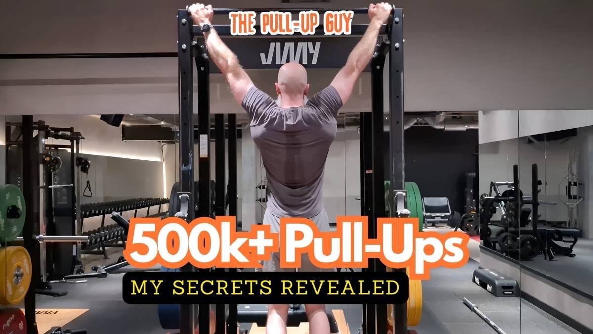 Rear view of Phil Jessé performing a strict-form wide-grip pull-up, building physical and mental endurance.